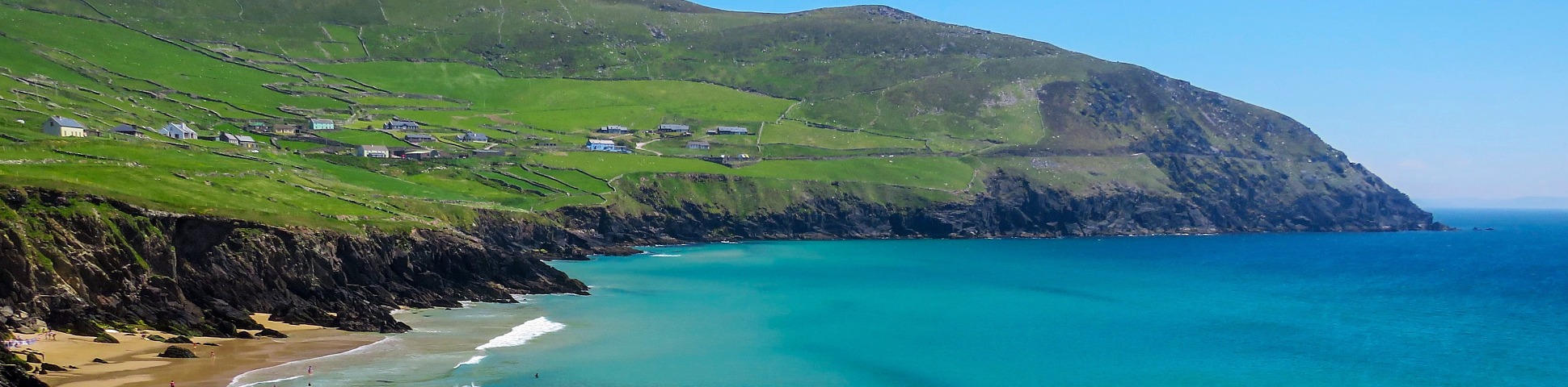 Green hills and blue ocean on the coastline of Kerry in Ireland