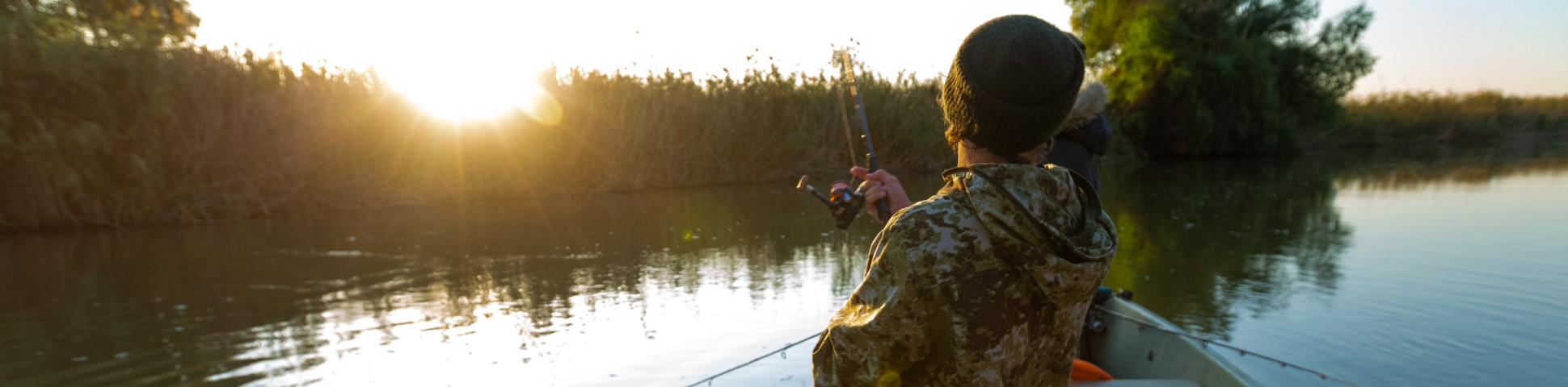 Fishing in a lake during the sunset