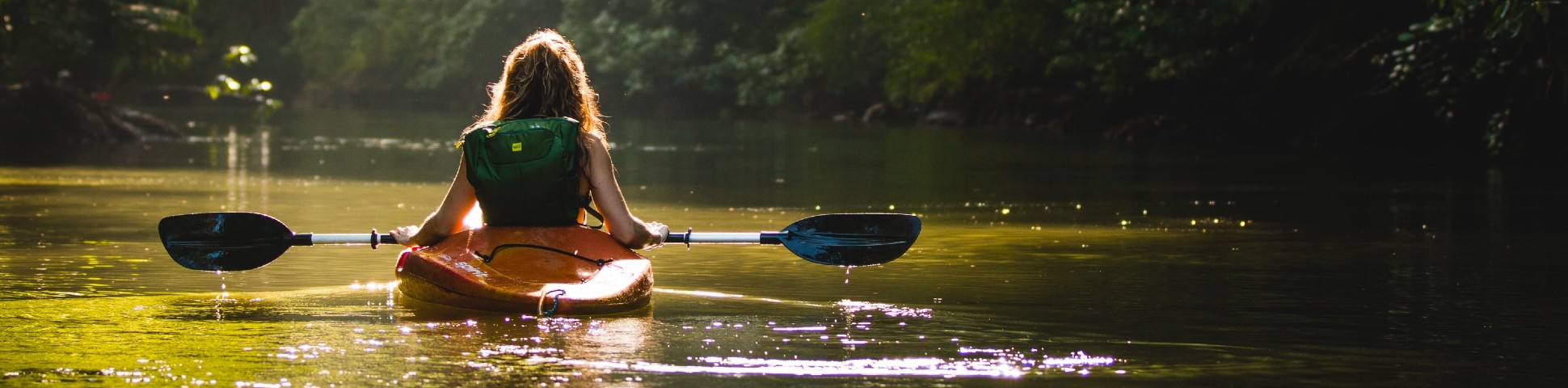 Lady kayaking in the river