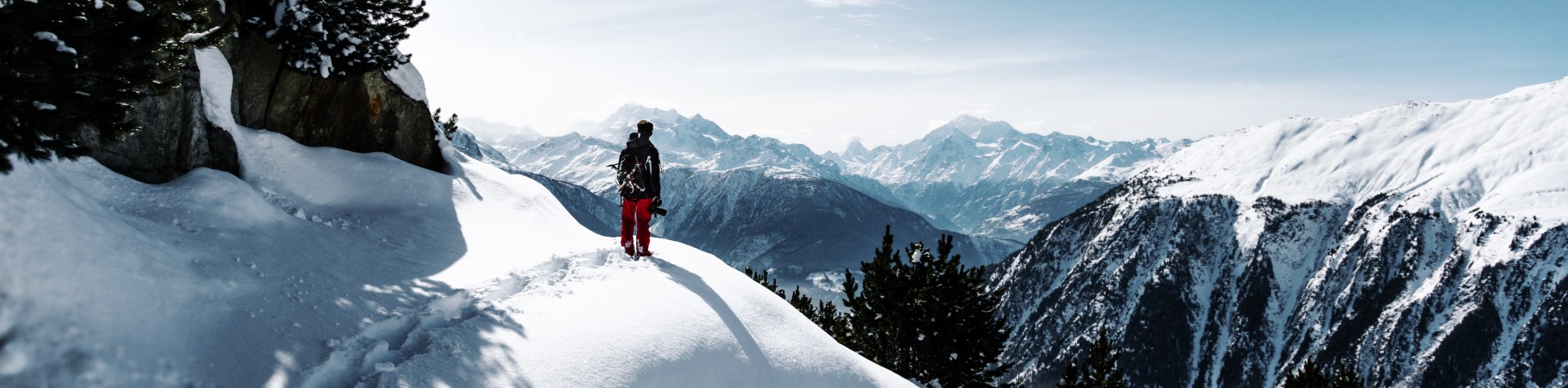 Hiker walking on powdery snow