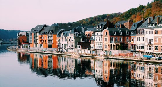 Colorful buildings along the river in Belgium