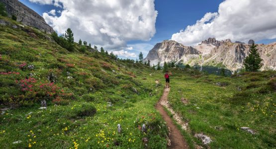 Hiker exploring the mountains in Trentino region (Italy)