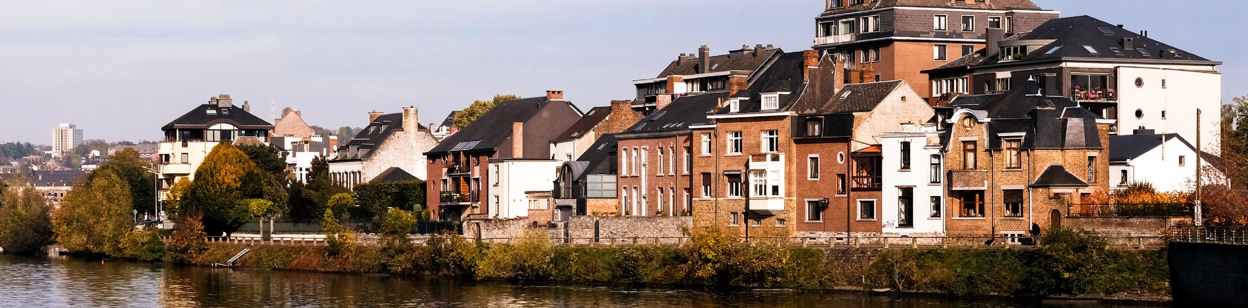 Buildings along the river in Wallonia, Belgium