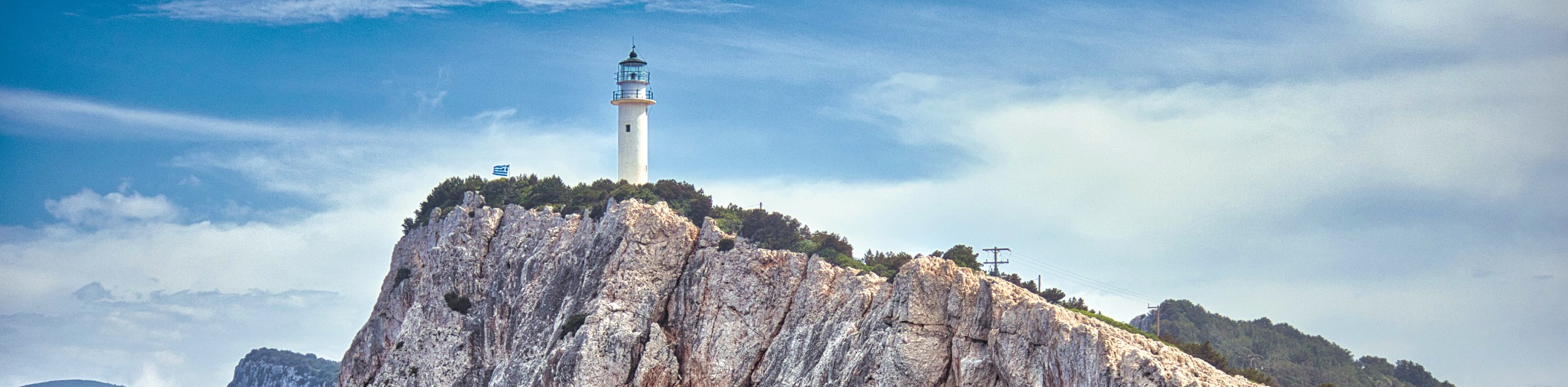 Lighthouse on the cliff in one of Ionian Islands (Greece)