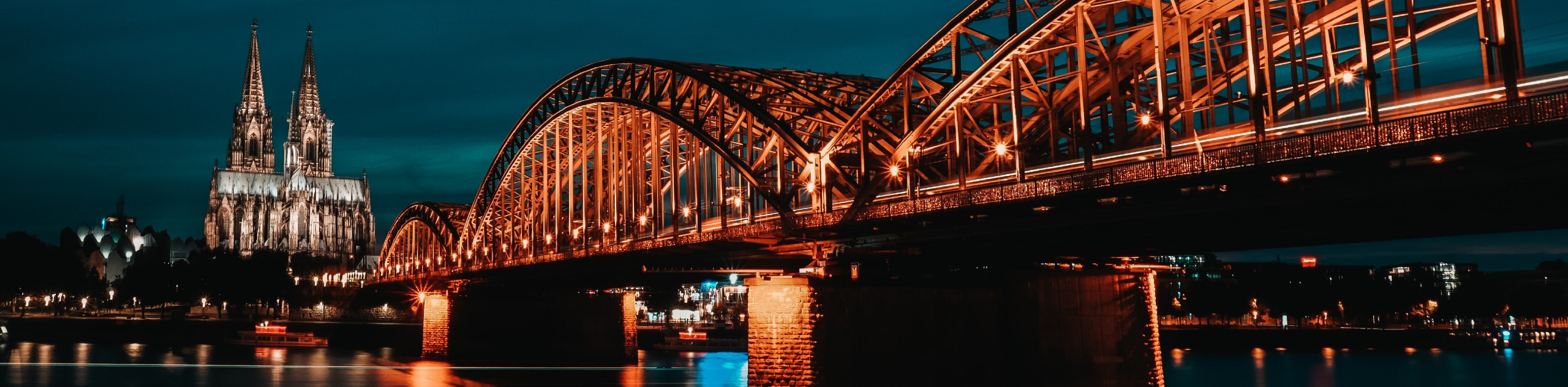 Night lights over the Rhone river and the gothic cathedral in North Rhine-Westphalia