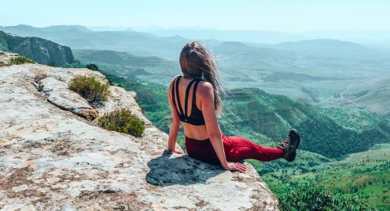 Girl in Drakensberg Mountains, overlooking the valley below