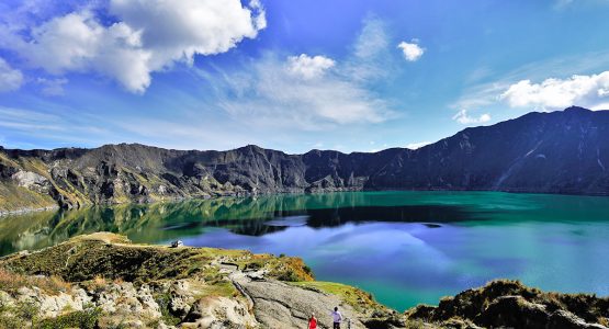 Hikers near Quilotoa crater on trekking tour in Ecuador in the Avenue of Volcanoes