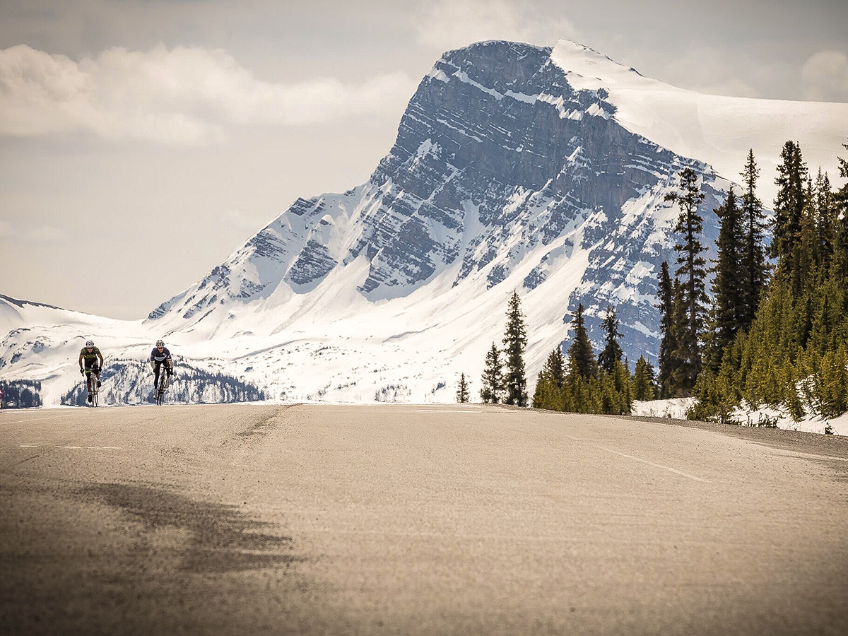 Two bikers on guided cycling tour from Jasper to Banff in Canada