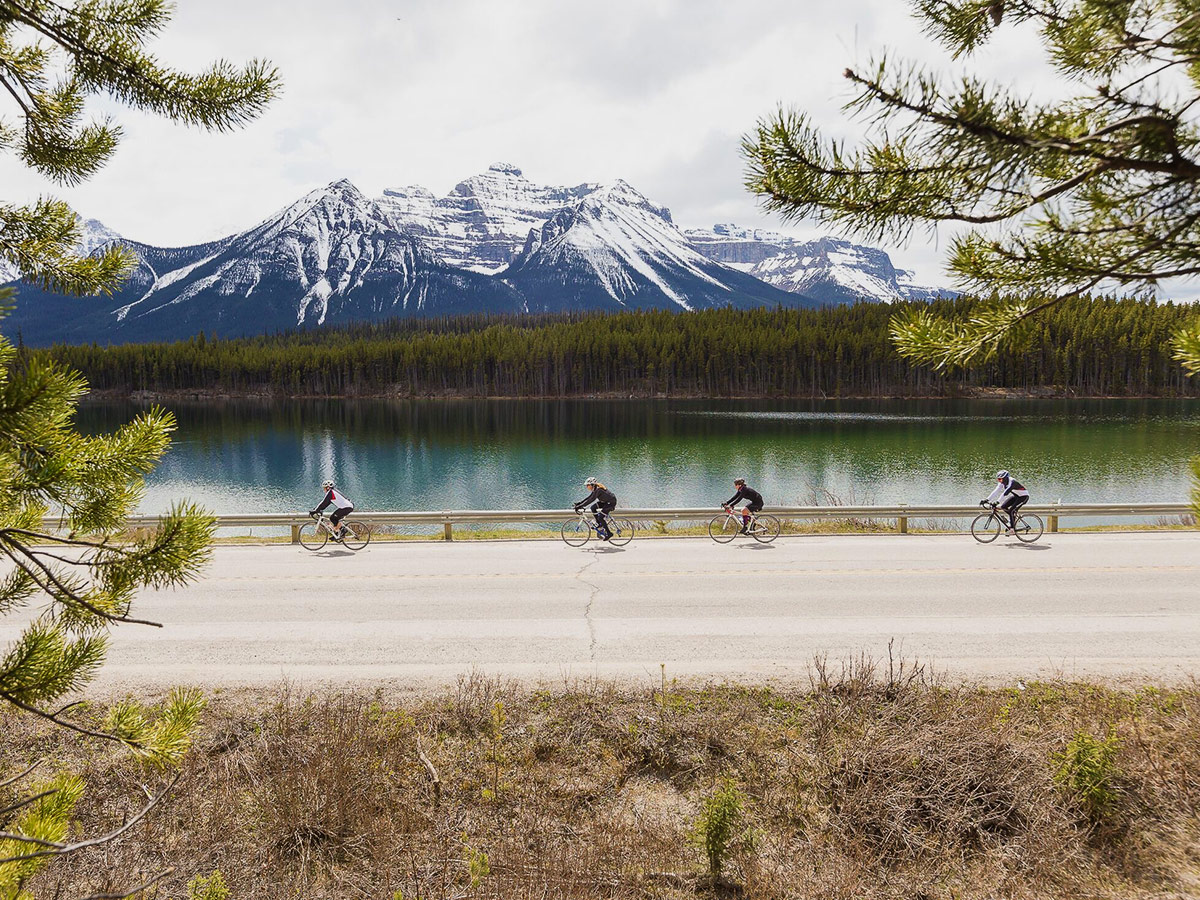 Cycling tour from Jasper to Banff in Canada takes place on the route surrounded by beautiful mountains