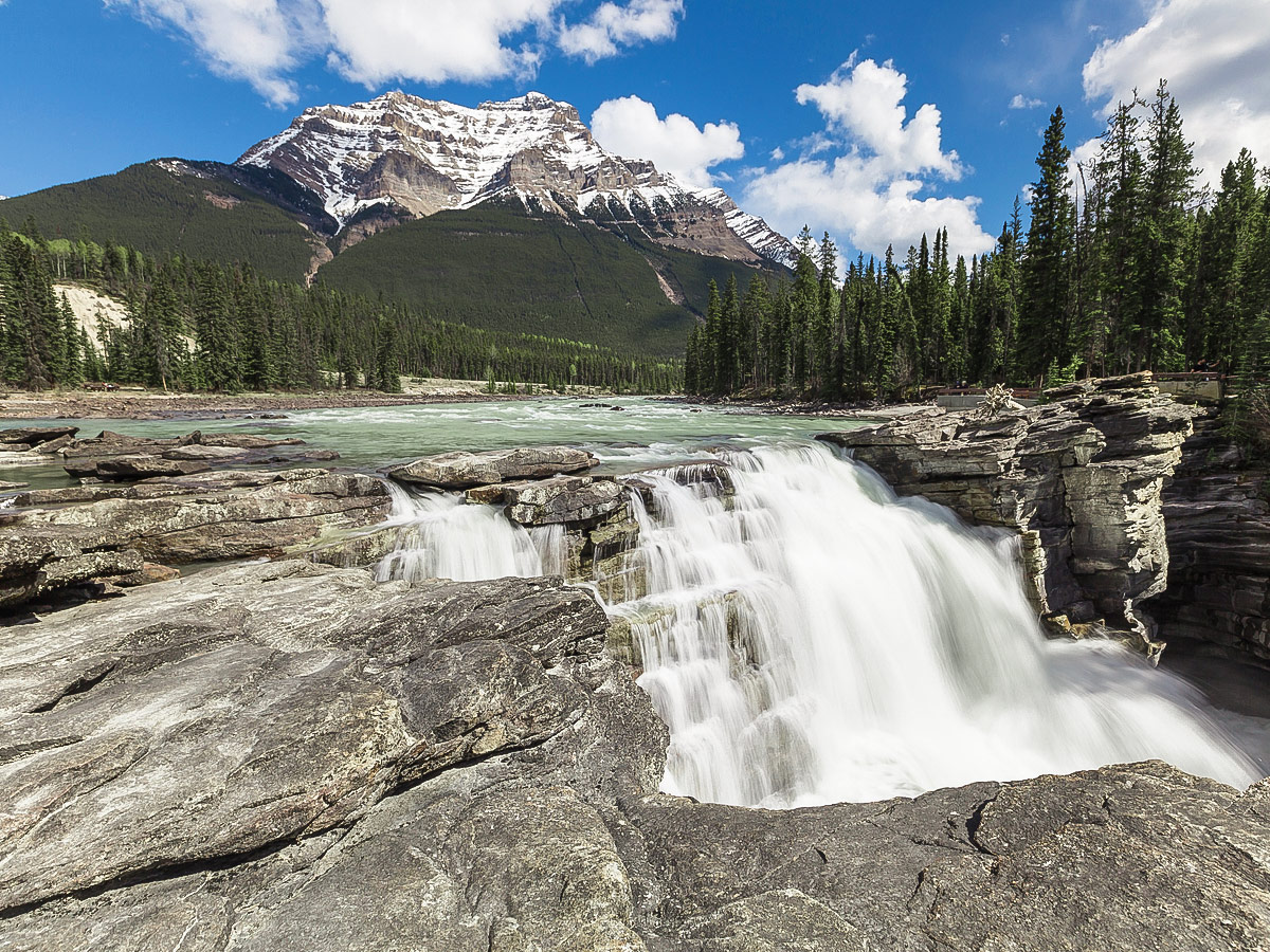 Big waterfall along the route of guided cycling tour from Jasper to Banff in Canada