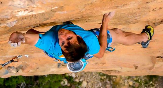 Climber on a steep rock wall