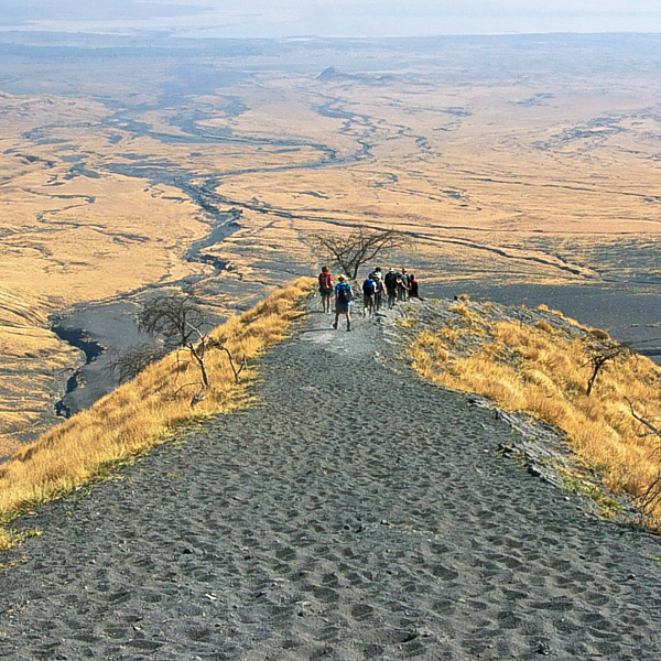 Hiking through desert wastelands on Kilimanjaro trek on Machame Route in Tanzania