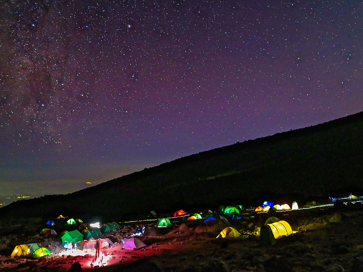 Beautiful lights of the tents on Kilimanjaro trek on Machame Route in Tanzania