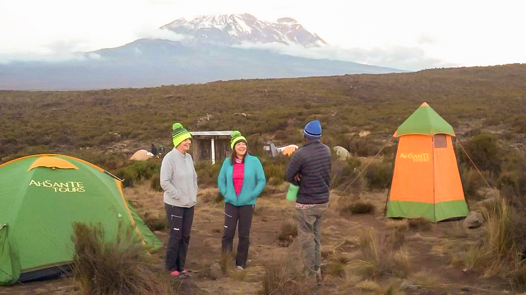 Group of happy hikers on Kilimanjaro trek on Machame Route in Tanzania