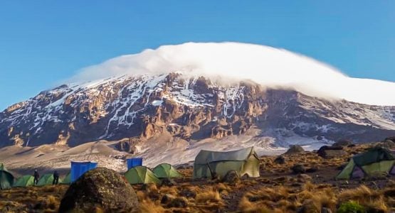 Tents in front of mount Kilimanjaro on Kilimanjaro trek on Machame Route in Tanzania