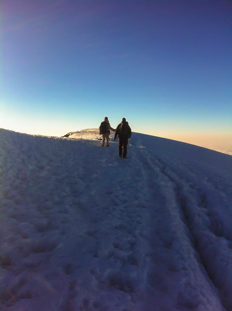 Trekking on snow on Kilimanjaro trek on Machame Route in Tanzania