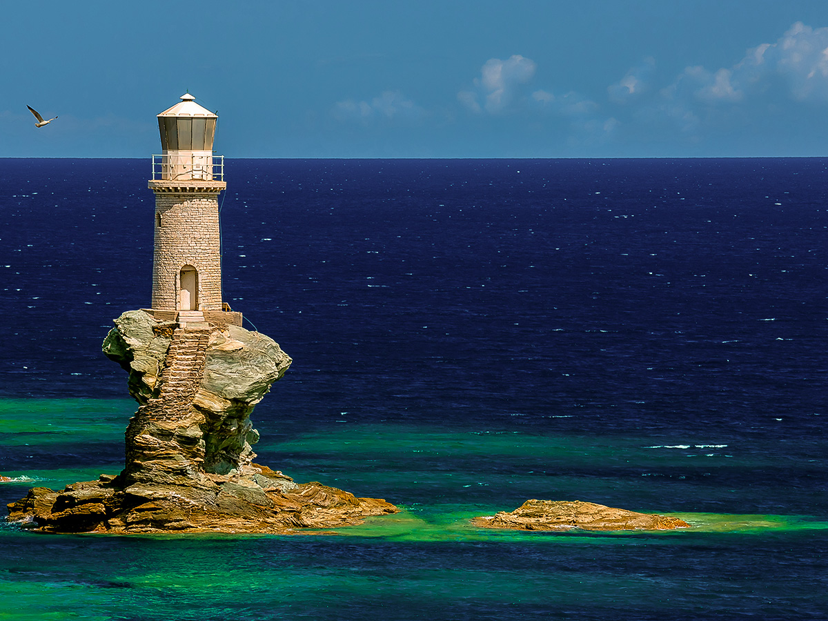 Beautiful lighthouse on Authentic Greek Islands hiking tour on Andros & Tinos