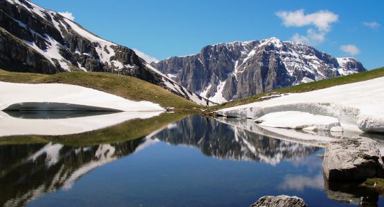 Trekking below Astraka on tour of Pindos Mountains trail in Greece