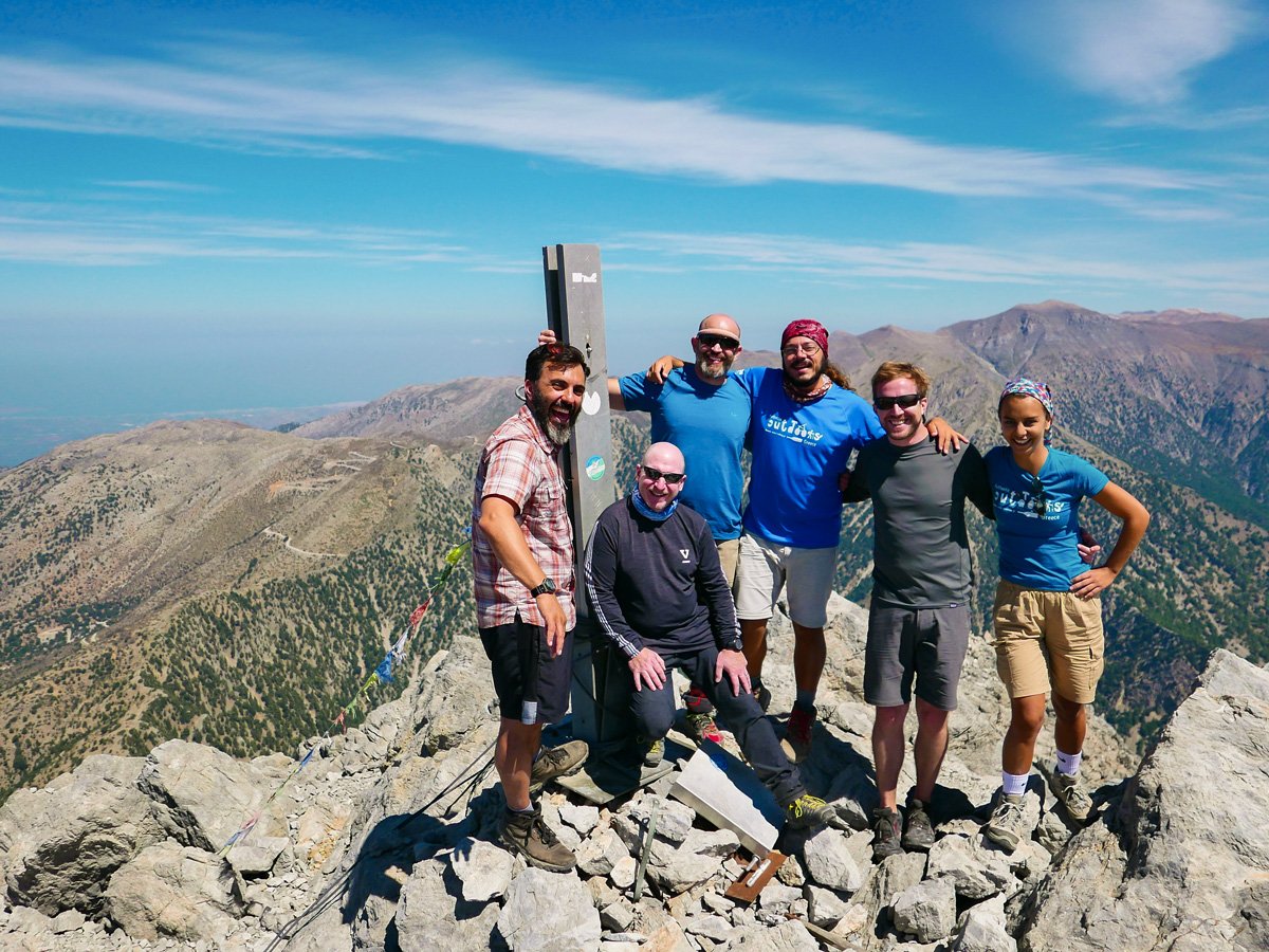 Happy hikers on top of Mt Gingilos on guided trek in the White Mountains of Crete, Greece