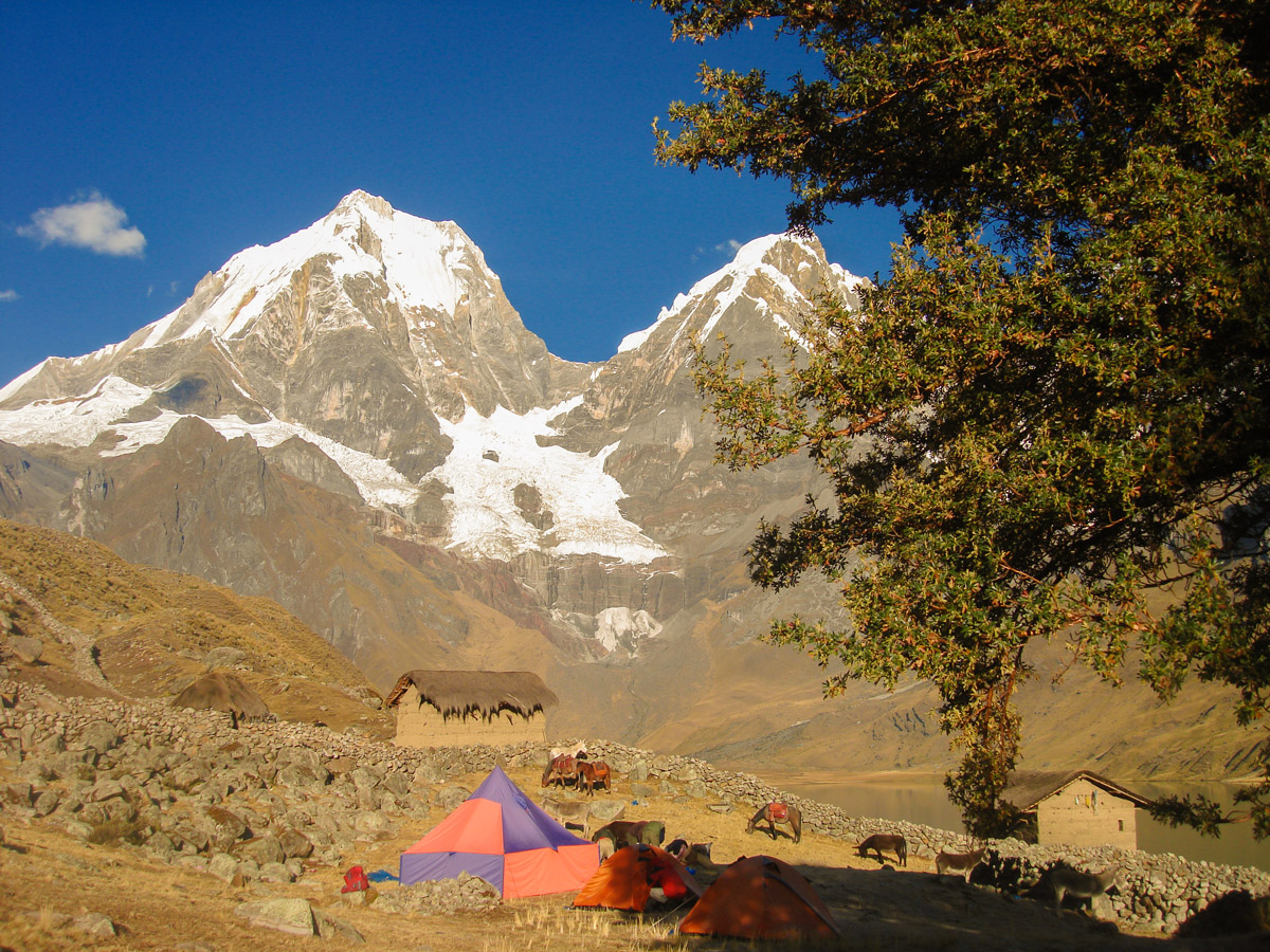 Tents, horses and mountains on Huayhuash circuit trek, Peru