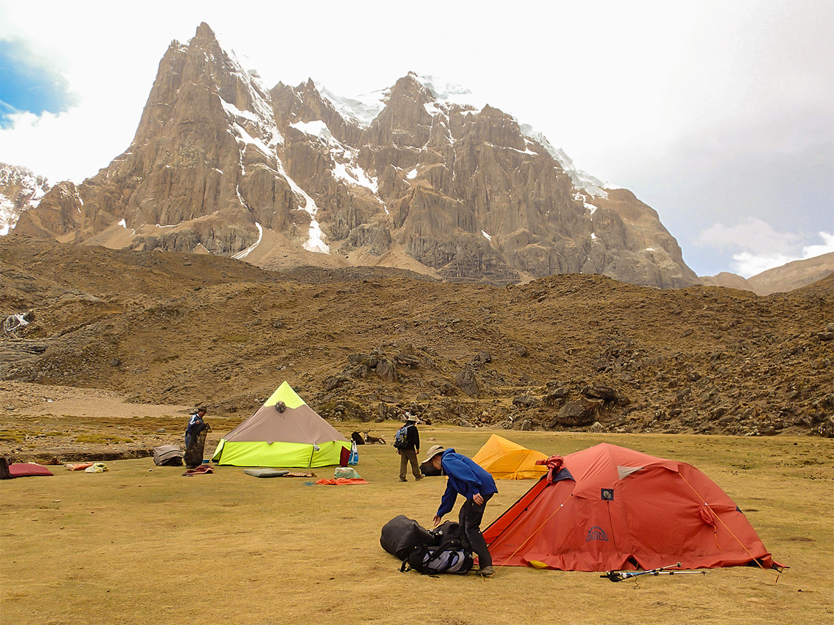 Hikers and the campsite on Huayhuash circuit trek, Peru