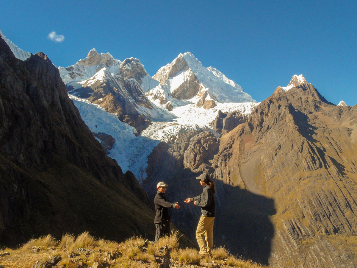 Giving a tip for a guide on Cordillera Huayhuash trek, Peru