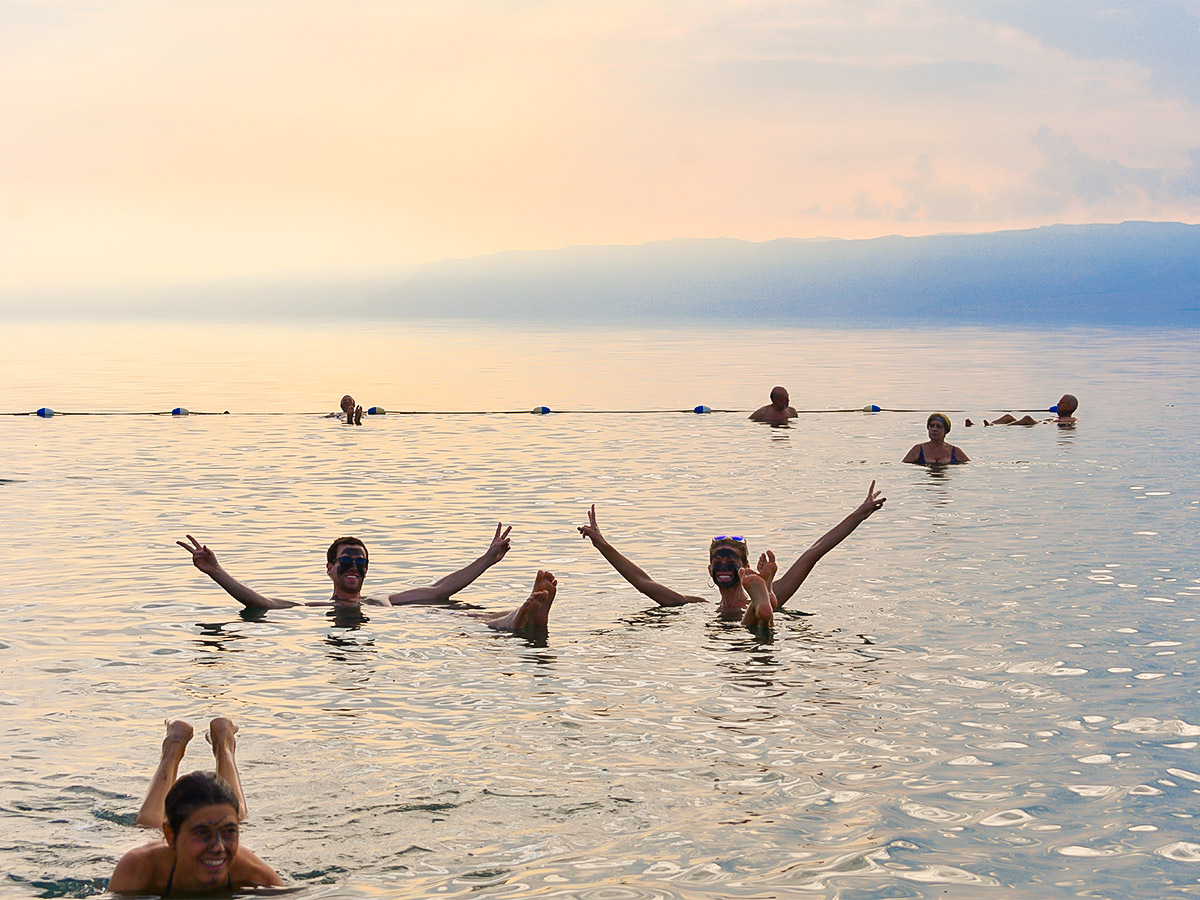 Swimming in Dead Sea on Dana to Petra Trekking Tour in Jordan