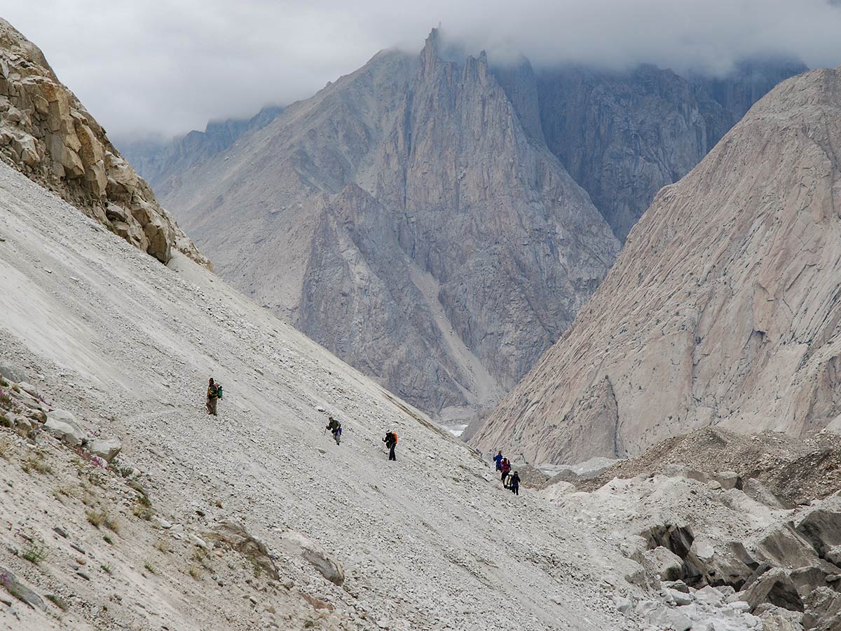 Trekking beside Baltoro Glacier on the way to K2 base camp on trekking tour on K2 Base Camp and Gondogoro La Trek in Pakistan