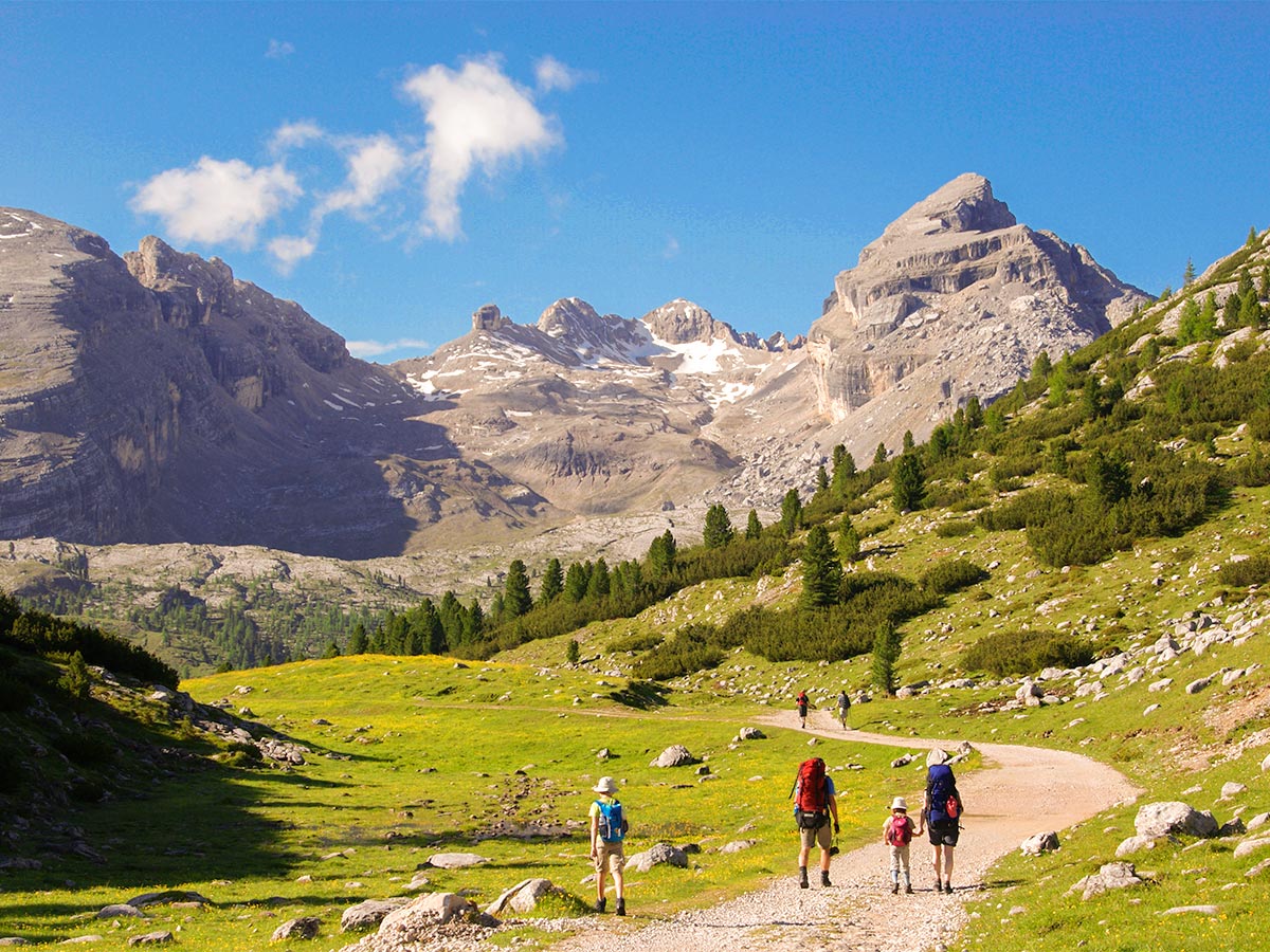 Family hiking on Dolomites Haute Route Trek in Italy