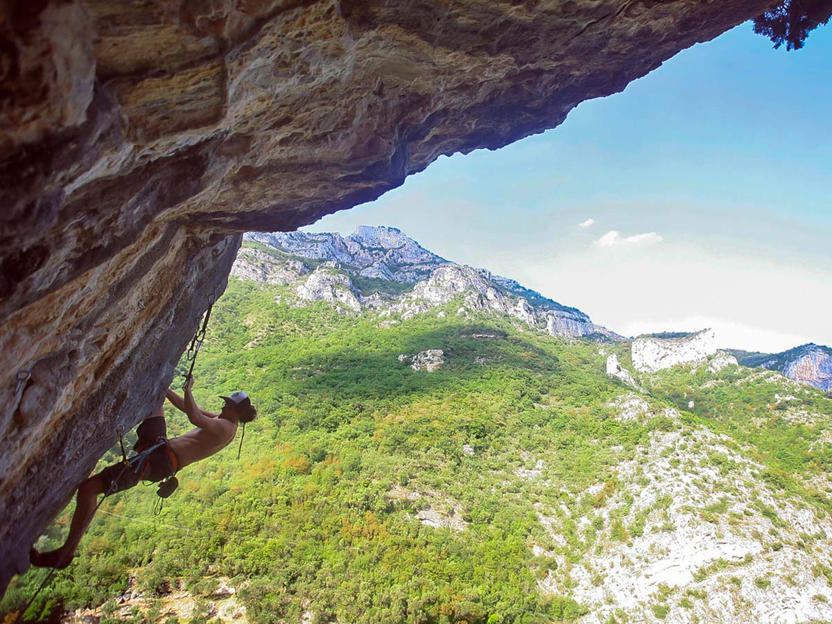 Rock climber and beautiful views on climbing camp in Savona