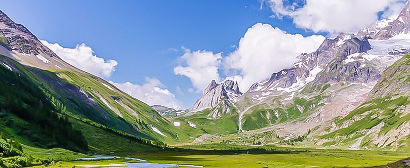 Beautiful valley surrounded by mountains on self-guided Tour du Mont Blanc