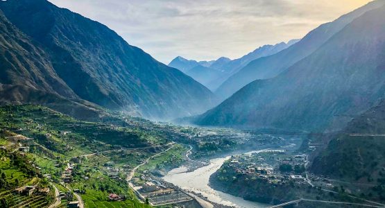 View of the village in the valley from Karakorum Highway on Hanza Valley Overland Tour in Pakistan