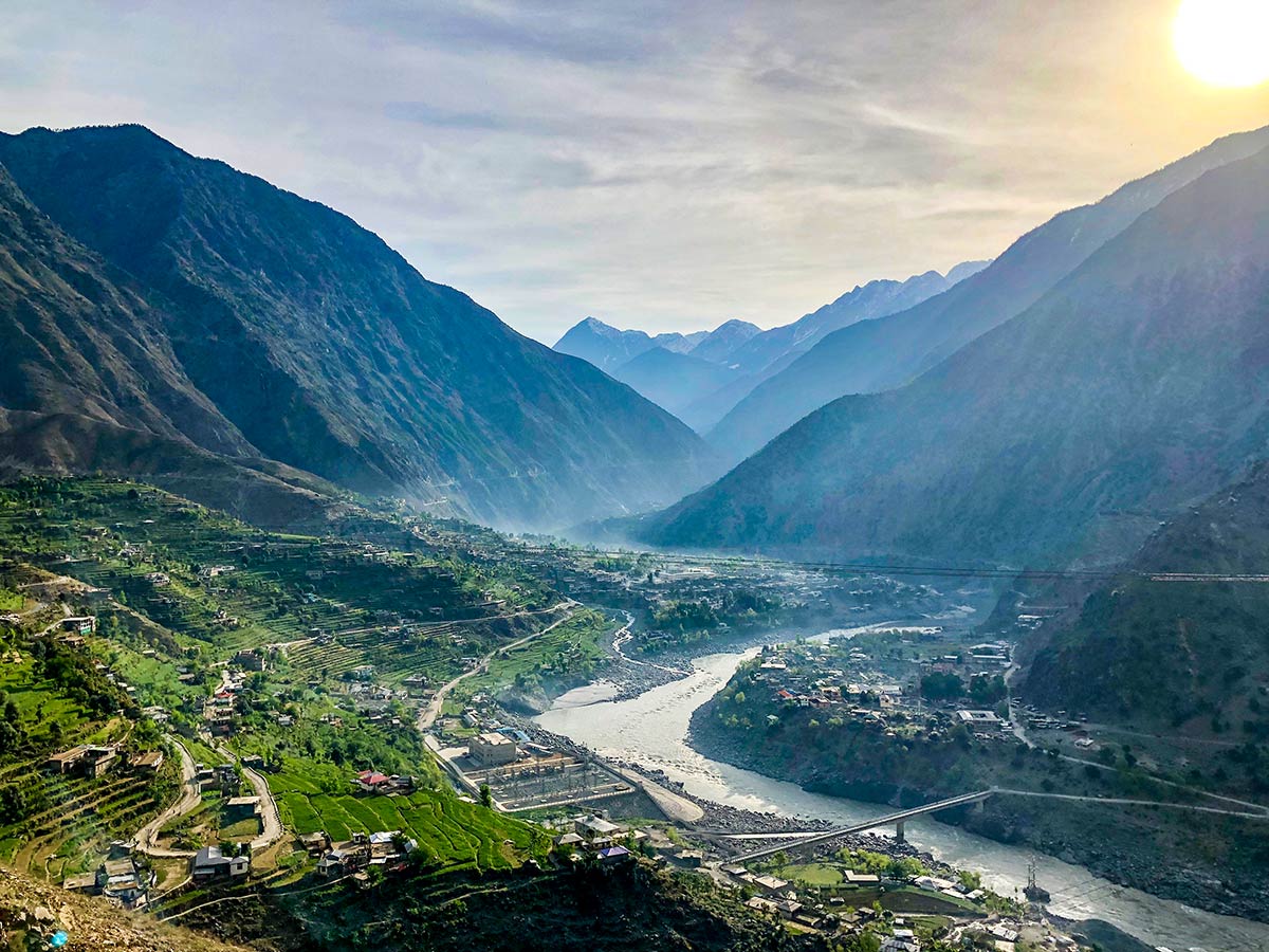 View of the village in the valley from Karakorum Highway on Hanza Valley Overland Tour in Pakistan