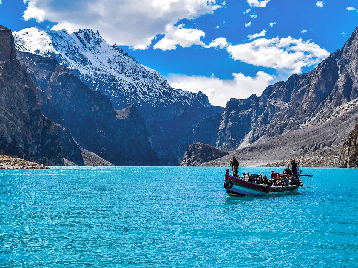 Boat full of people on Attabad Lake on Hanza Valley Overland Tour