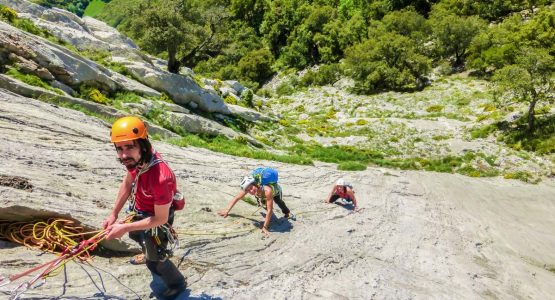 Group of climbers on Mont Rebei on Trad and Multipitch rock climbing tour in Riglos, Spain