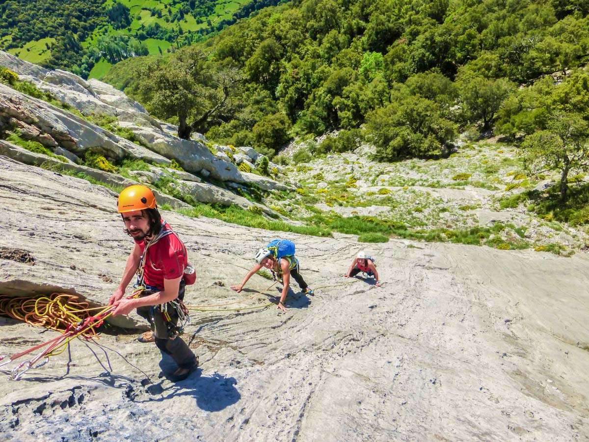 Group of climbers on Mont Rebei on Trad and Multipitch rock climbing tour in Riglos, Spain