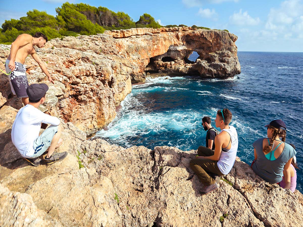 Climbers looking down on the crag in Mallorca