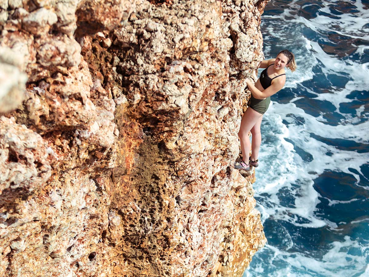 Woman climbing on DWS camp in Mallorca