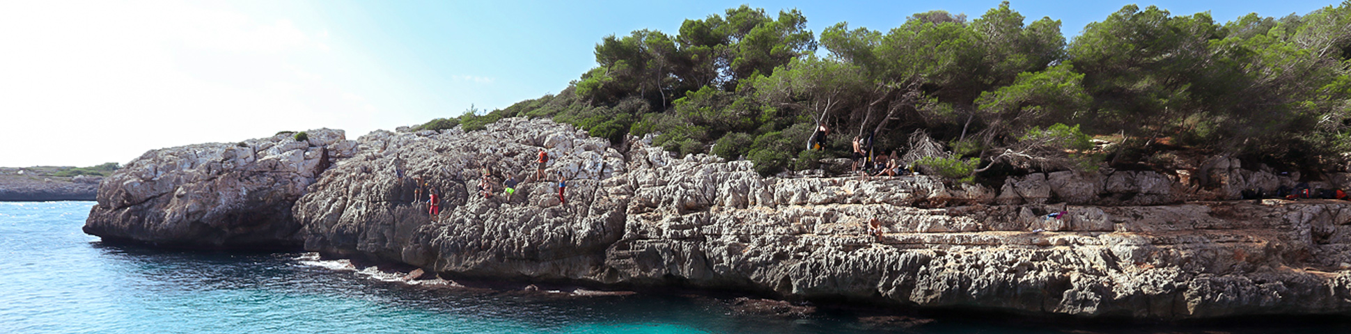 Group of rock climbers above the crag on DWS camp in Mallorca