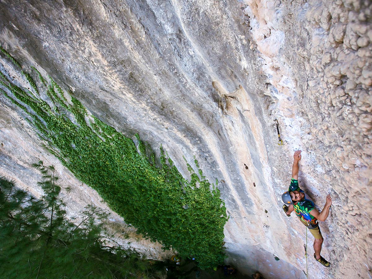 Happy man on rock climbing tour in Margalef, Spain