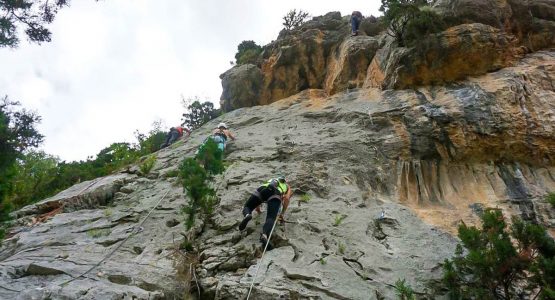 Three rock climbers on Women's climbing camp in Rodellar, Spain