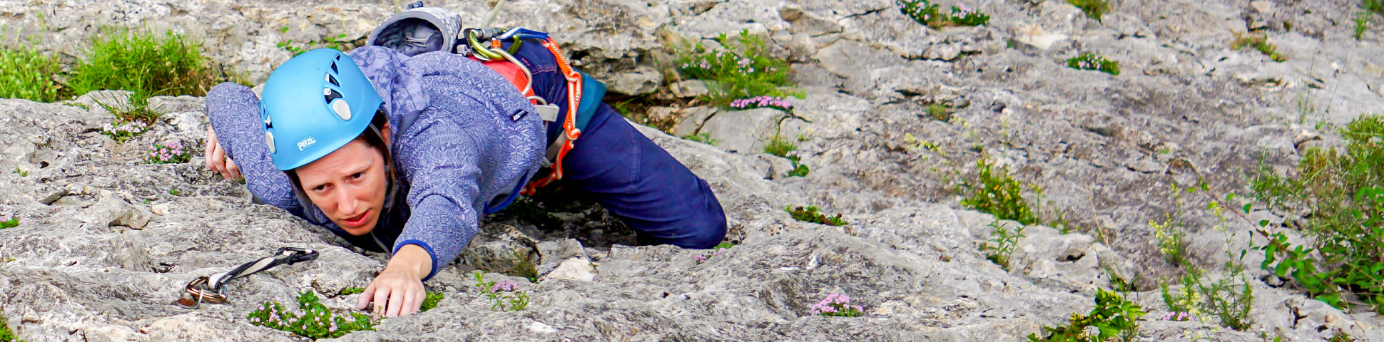 Climber on a rock in Spain on women's only climbing tour in Rodellar