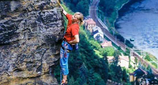 Rock climber and beautiful views on climbing camp in Czech Republic