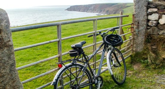 Cornwall Cycling Coast Bike against gate