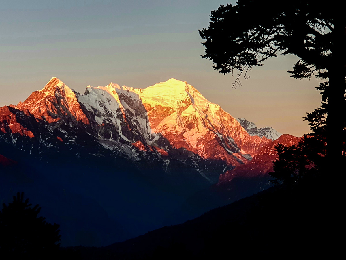 Sunset over the Himalayan mountains on guided Langtang Trek in Nepal