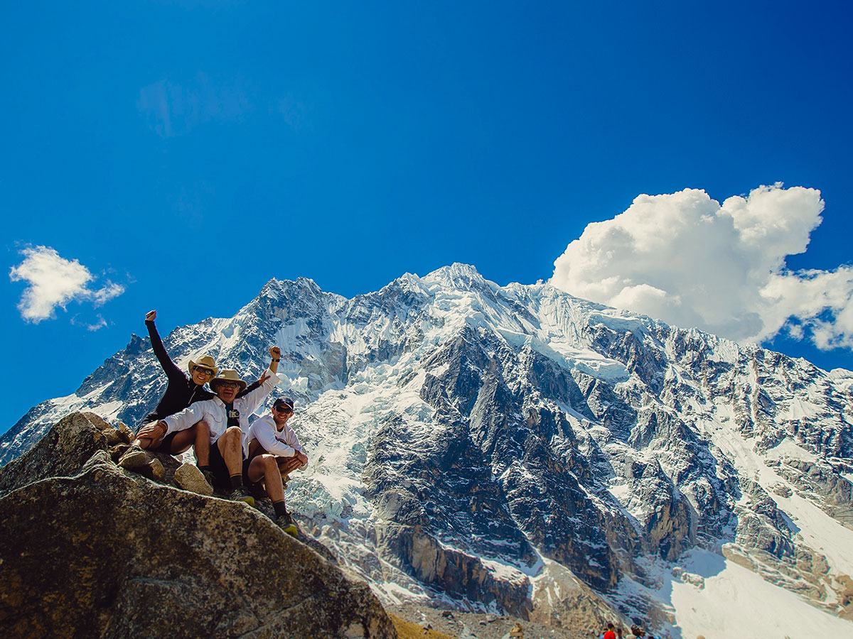 Hikers posing in front of the mountain on Salkantay Trek to Machu Picchu in Peru