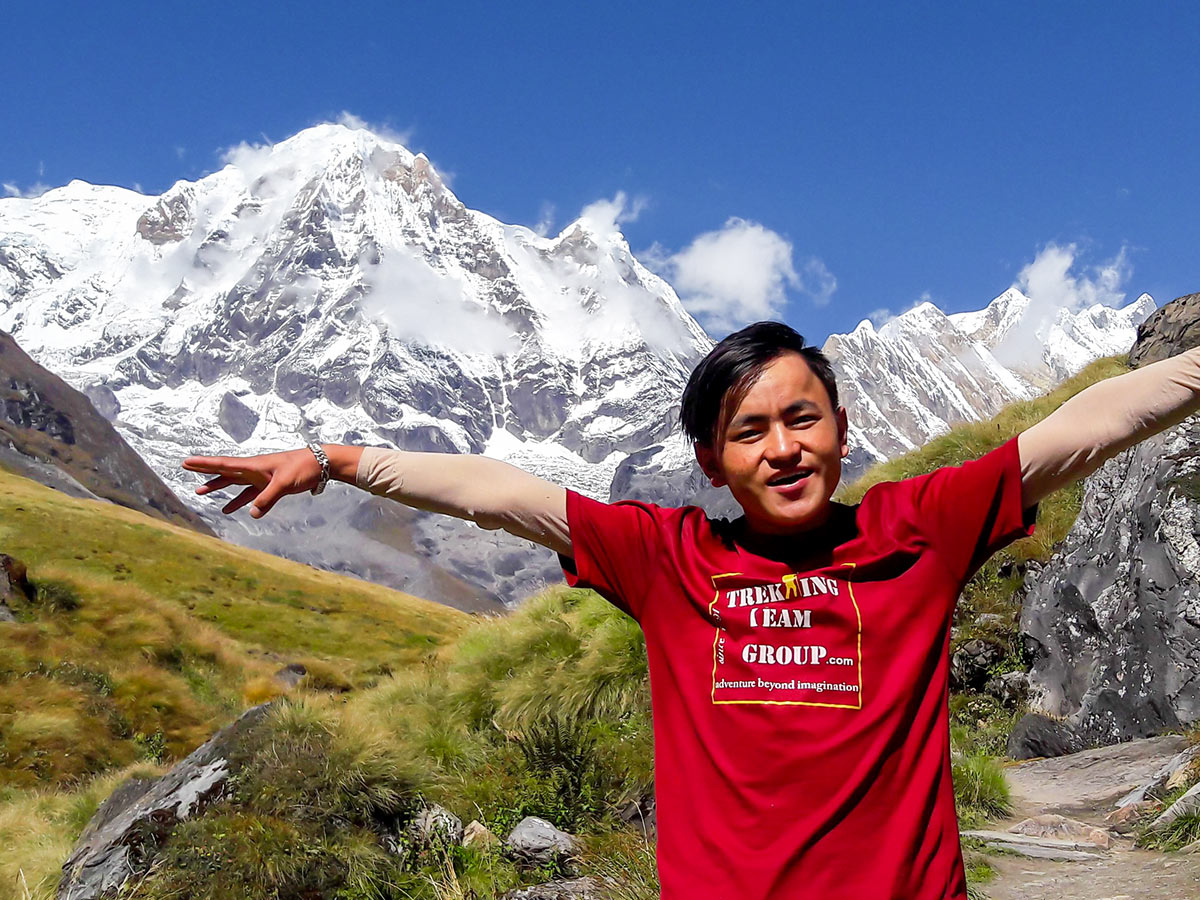 Guide posing in front of the massif on Annapurna Base Camp Guided Trek in Nepal