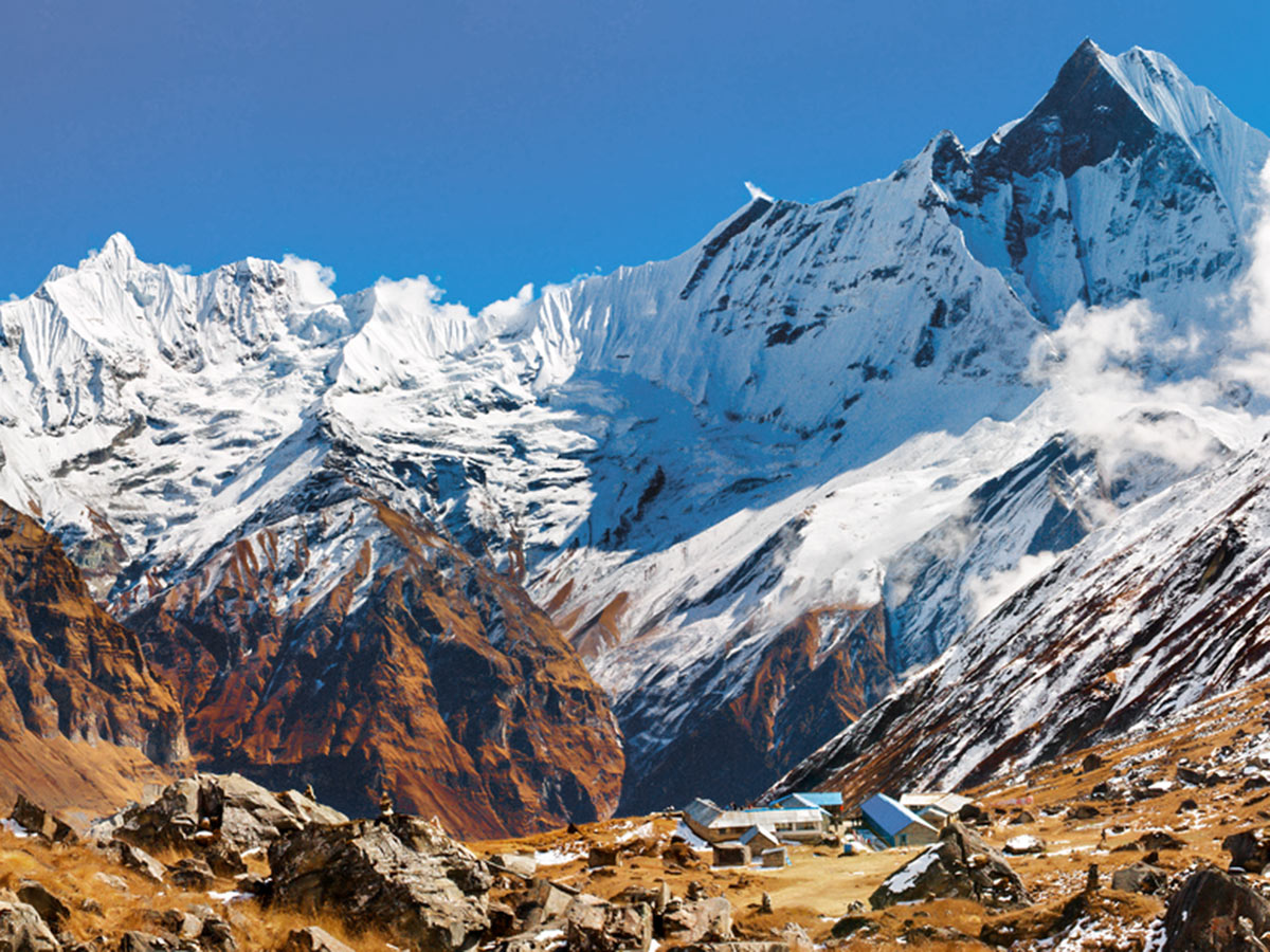 Mountain lodge overlooking beautiful Himalayan mountains on Annapurna Base Camp Guided Trek in Nepal