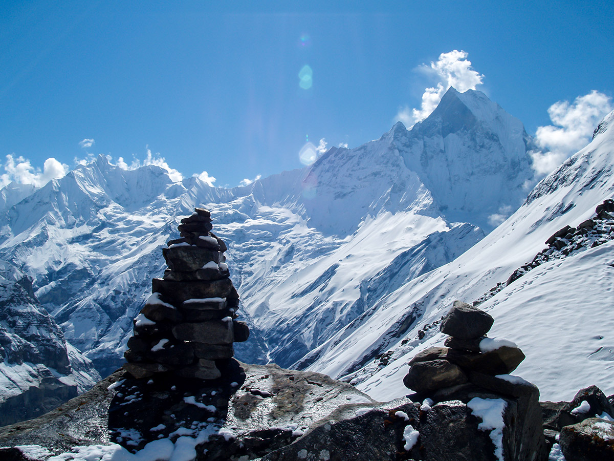 Cairn in front of mountain peaks on Annapurna Base Camp Guided Trek in Nepal