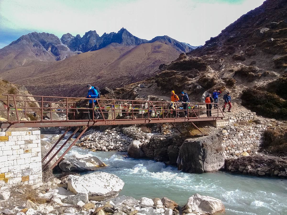 Trekkers crossing the bridge on Everest Base Camp trek in Nepal